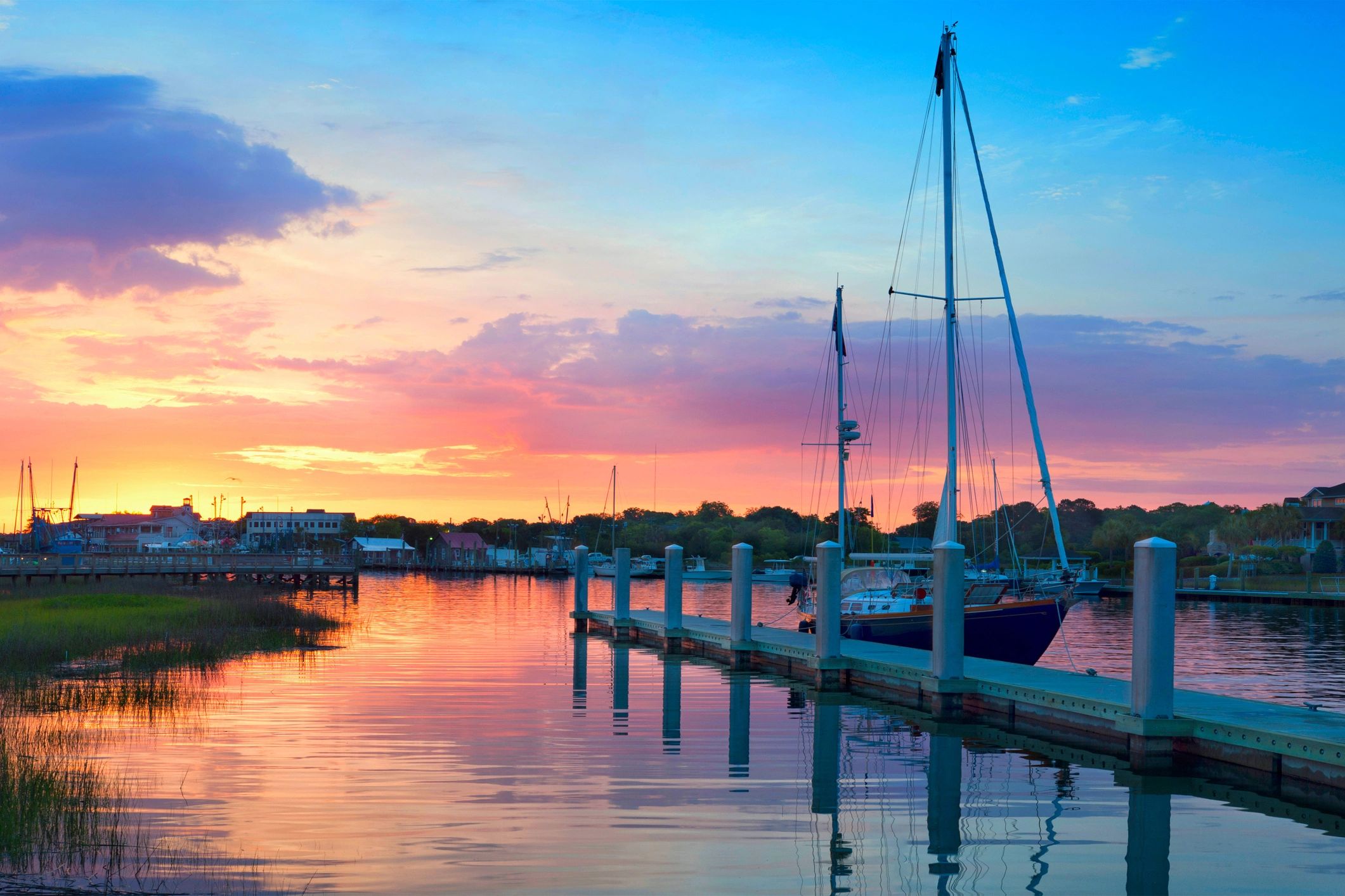 Sailboat being prepared for delivery at sunrise